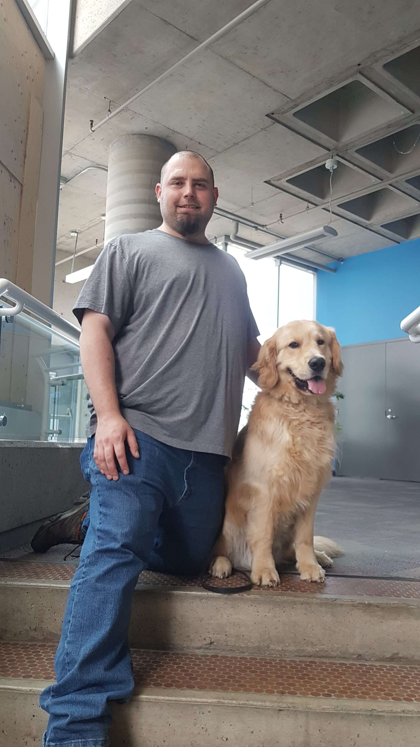 Scott, certified K9 handler, with detection dog Rino